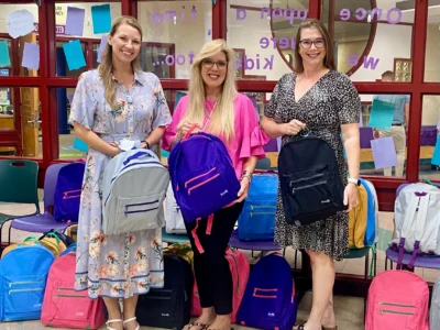 Angelina Gray and Stacy McFarland with Kristen Martin, principal, of TA Lowery Elementary School. There were 30 backpacks delivered to excited kids and staff this morning!